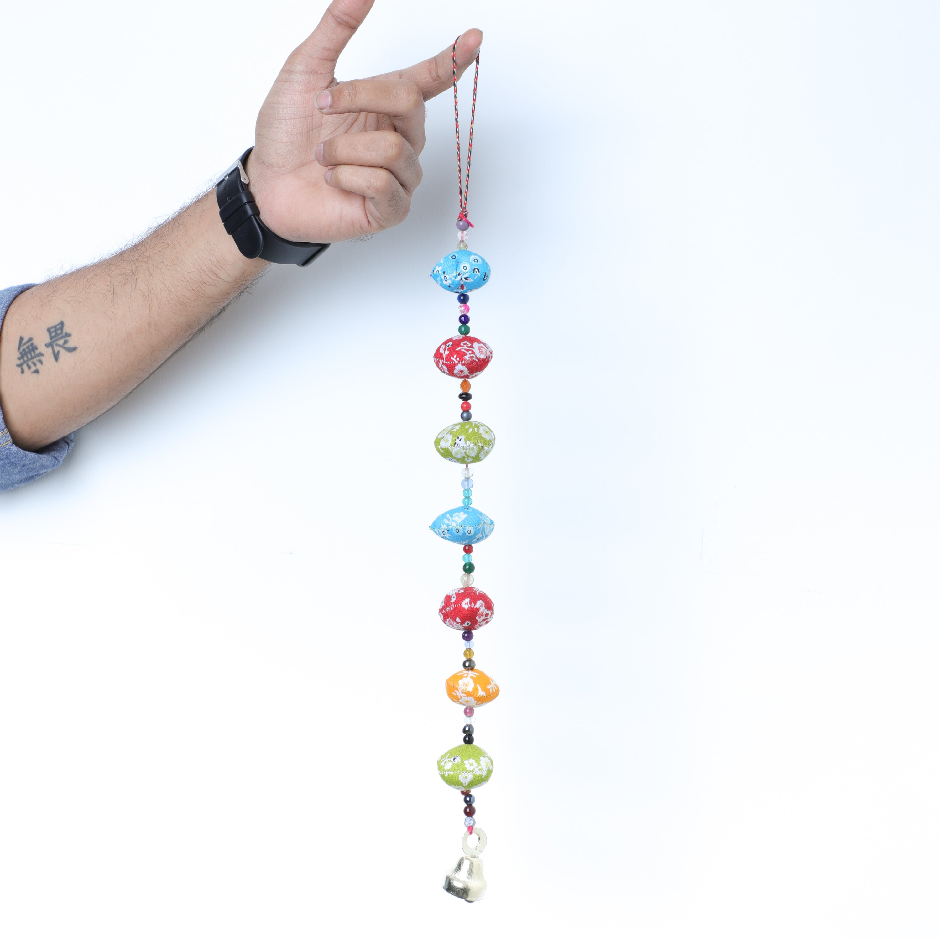 Showing the size by holding Fabric Tassel Hanging